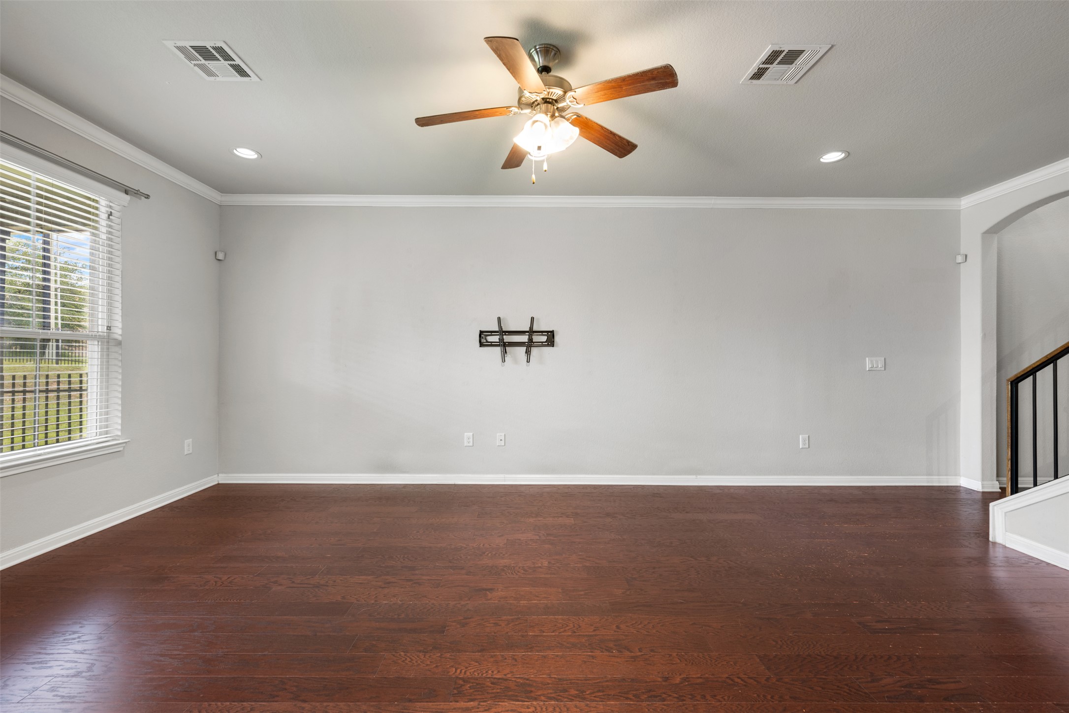 211 Parable Cove Pflugerville, TX 78660 - Photo 8 of 40 Spacious living area featuring wood-finish flooring, recessed lighting, and a ceiling fan with integrated lighting