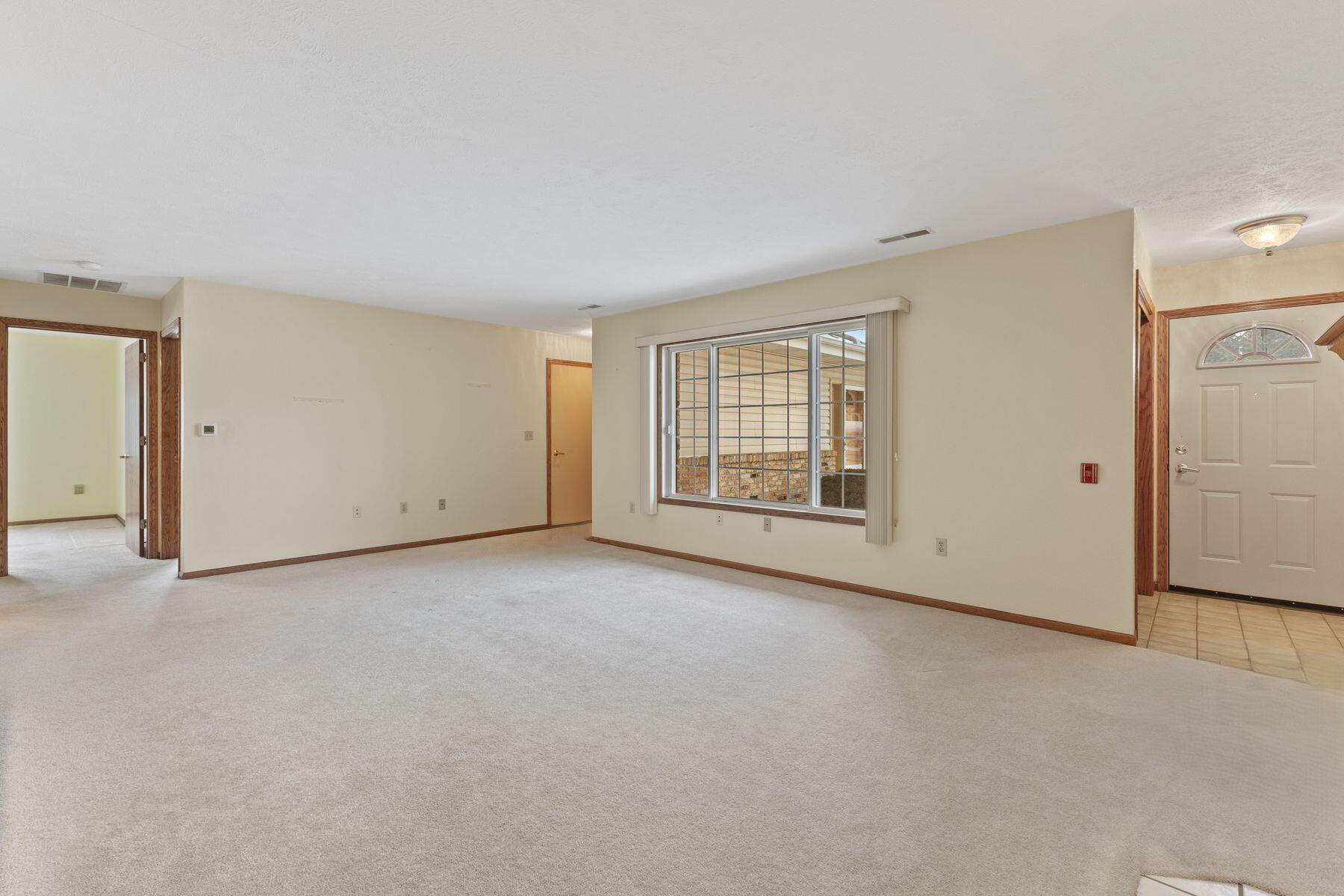 1680 96th Street, Unit 7 Sturtevant, WI 53177 - Photo 4 of 26 Door on the left is the garage access