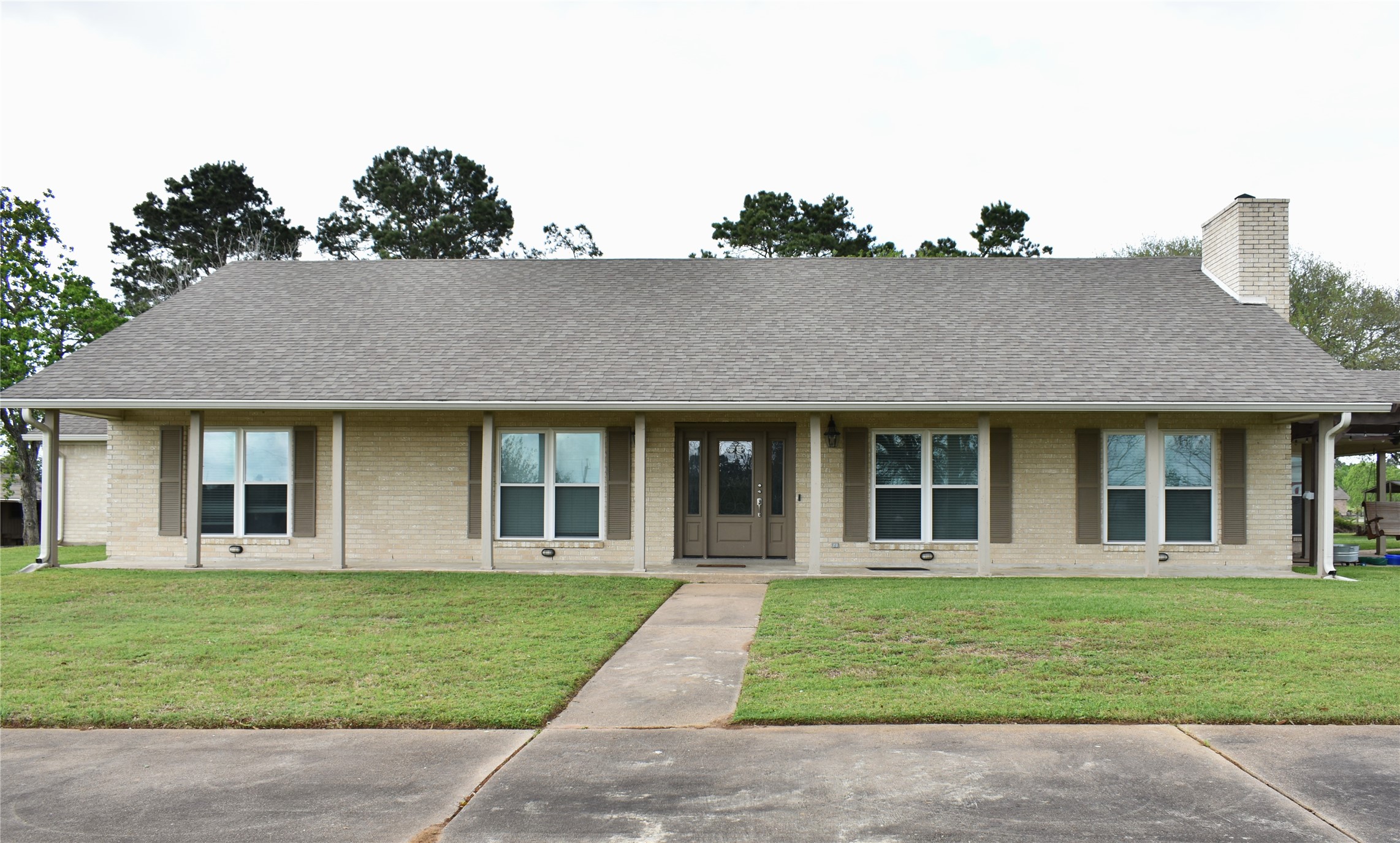 front view of a house with a yard