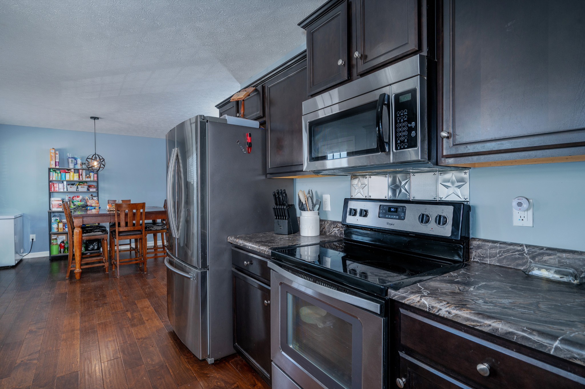 2995 Oak Grove Church Road Bethpage, TN 37022 - Photo 11 of 28 a kitchen with a stove and a microwave