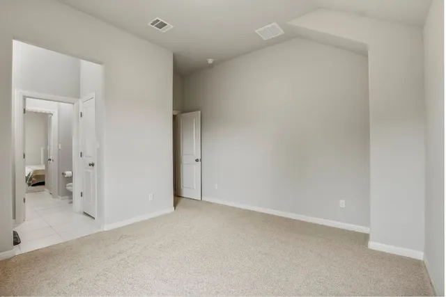 an empty room with a bathroom