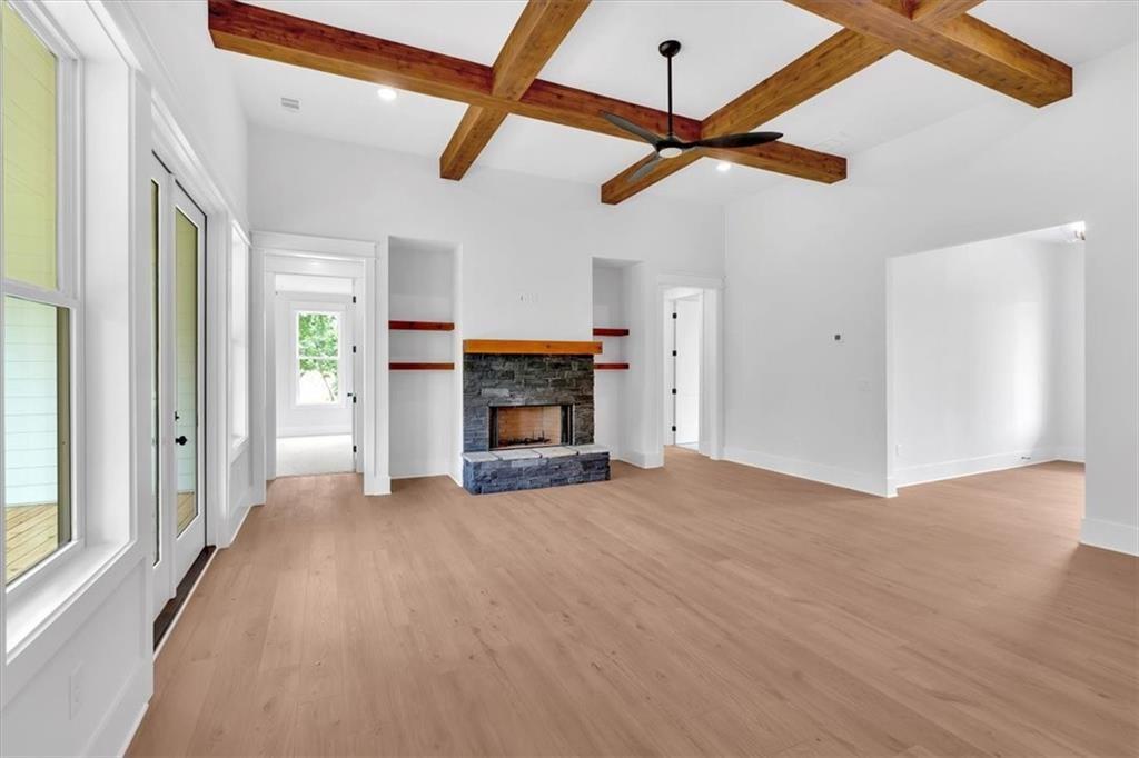300 Eminence Peak Rydal, GA 30171 - Photo 13 of 46 a view of empty room with fireplace and windows