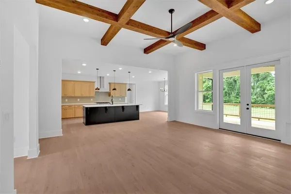 a view of a kitchen with a sink and a window