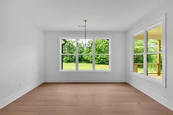 an empty room with windows and outdoor space