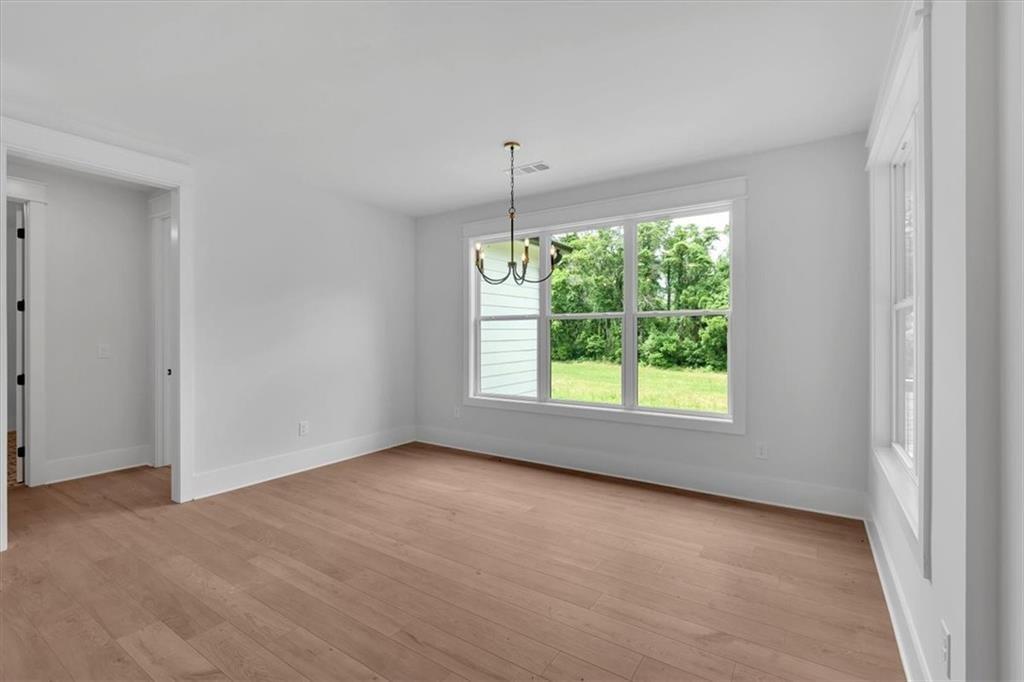 300 Eminence Peak Rydal, GA 30171 - Photo 23 of 46 an empty room with windows and outdoor view