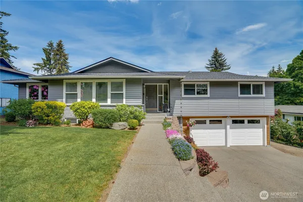 front view of a house with a yard