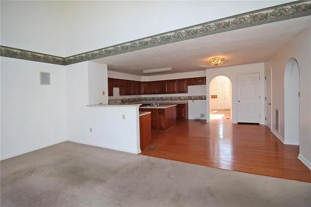 a view of a livingroom with wooden floor