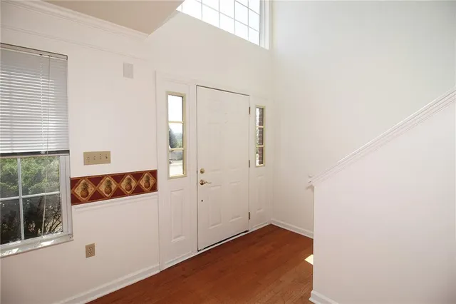 an entryway with wooden floor