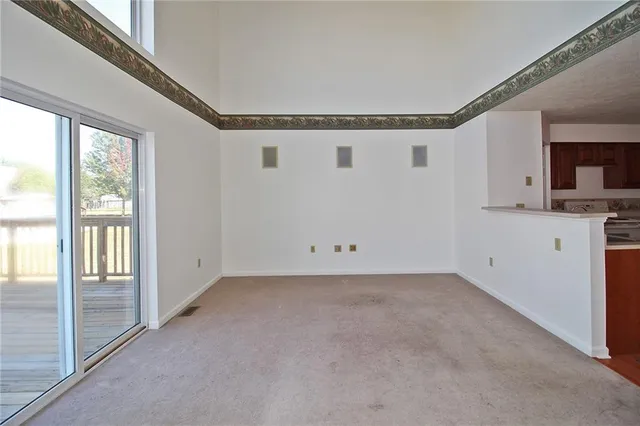 a view of a kitchen with a sink and dishwasher