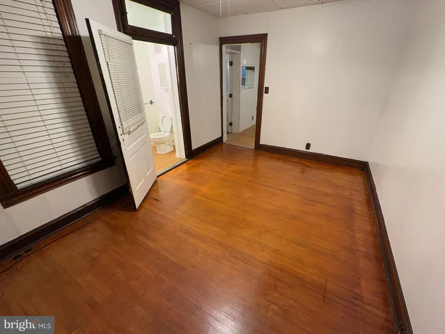 an empty room with wooden floor