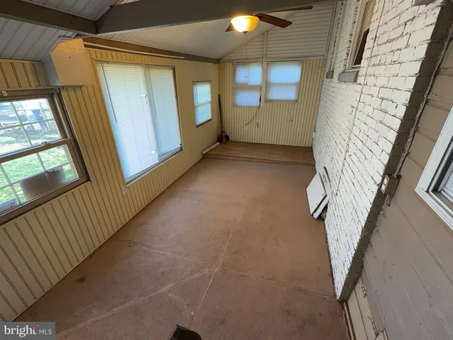 a view of entryway with window and stairs