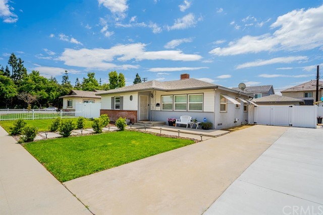 5318 Rochester Street Riverside, CA 92504 - Photo 1 of 1 a front view of a house with a yard
