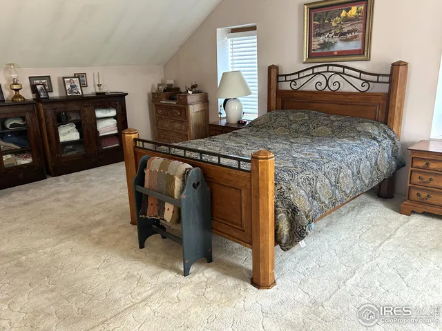 a bedroom with a bed and dresser