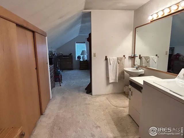 a view of a storage & utility room with closet