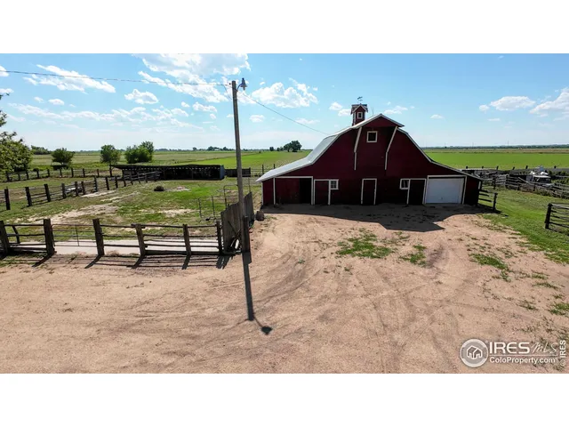 a balcony with furniture and a garden