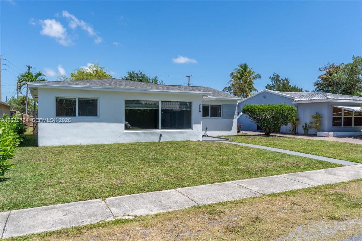 266 Southwest 6th Street Dania Beach, FL 33004 - Photo 37 of 37 a front view of a house with a yard
