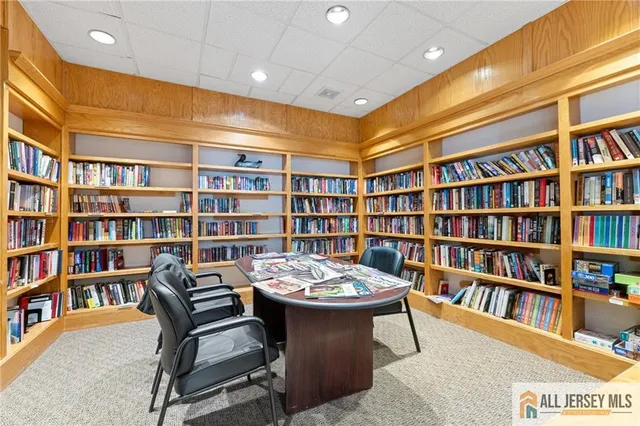 a view of a workspace with bookshelf