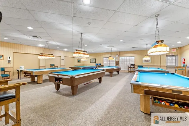 a room with pool table table tennis and table