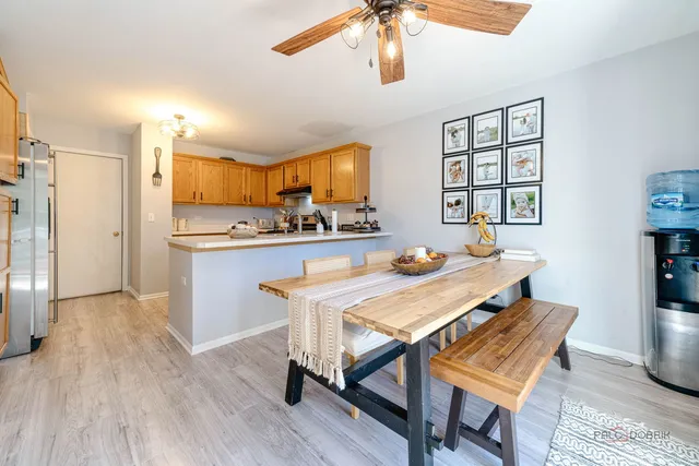 a view of a dining room with furniture and wooden floor