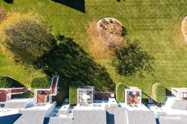 an aerial view of residential house with outdoor space and swimming pool
