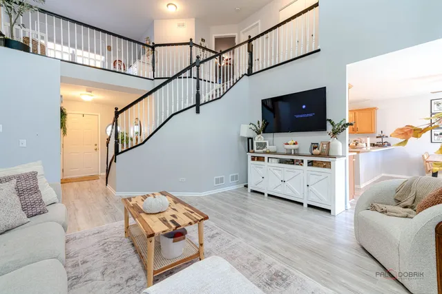 a living room with furniture and flat screen tv