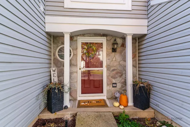 a front view of a house with a porch