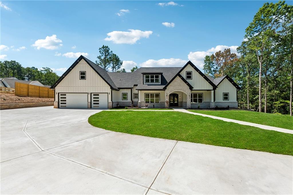 1622 Double Springs Monroe, GA 30656 - Photo 2 of 40 a front view of a house with a yard and garage