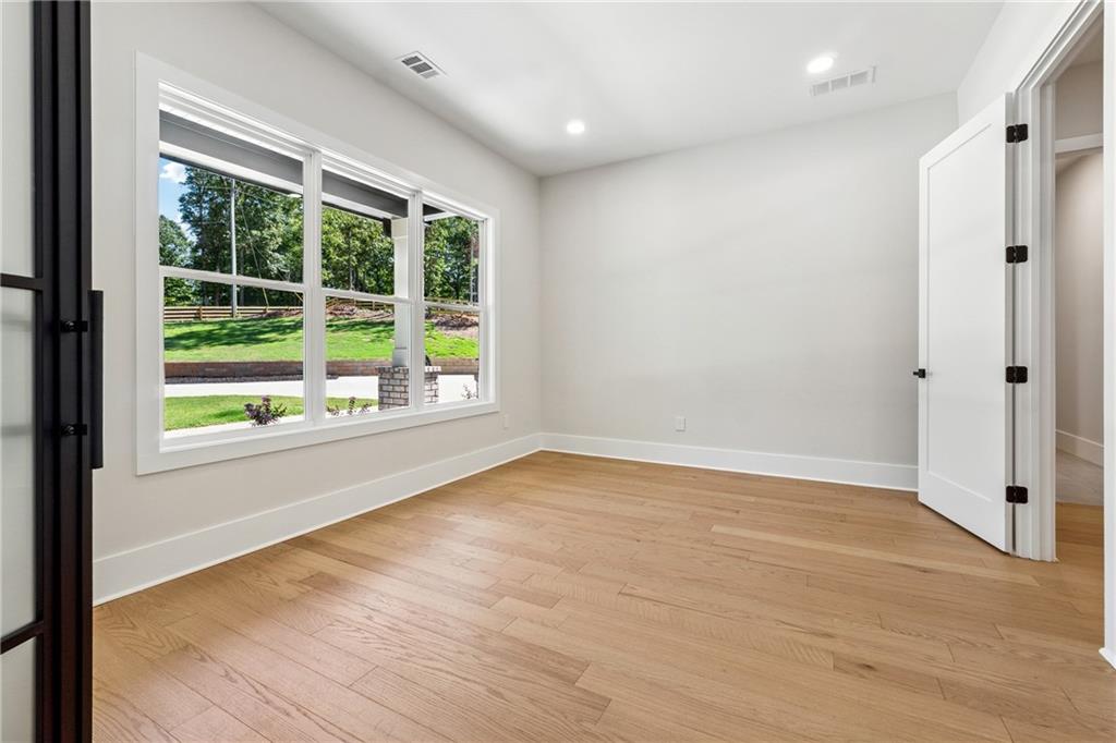 1622 Double Springs Monroe, GA 30656 - Photo 33 of 40 a view of an empty room with wooden floor and a window