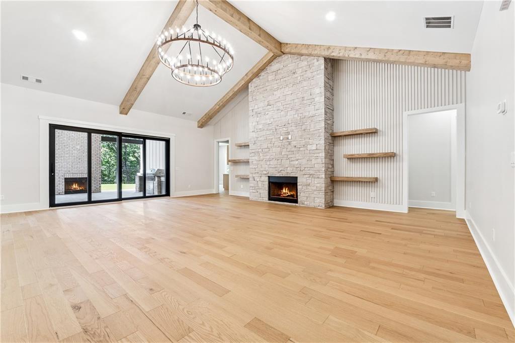 1622 Double Springs Monroe, GA 30656 - Photo 6 of 40 a view of an empty room with a fireplace and a window