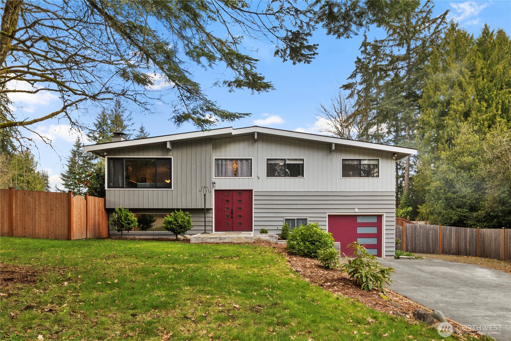 9 216th Street Southeast Bothell, WA 98021 - Photo 1 of 28 a front view of house with a garden