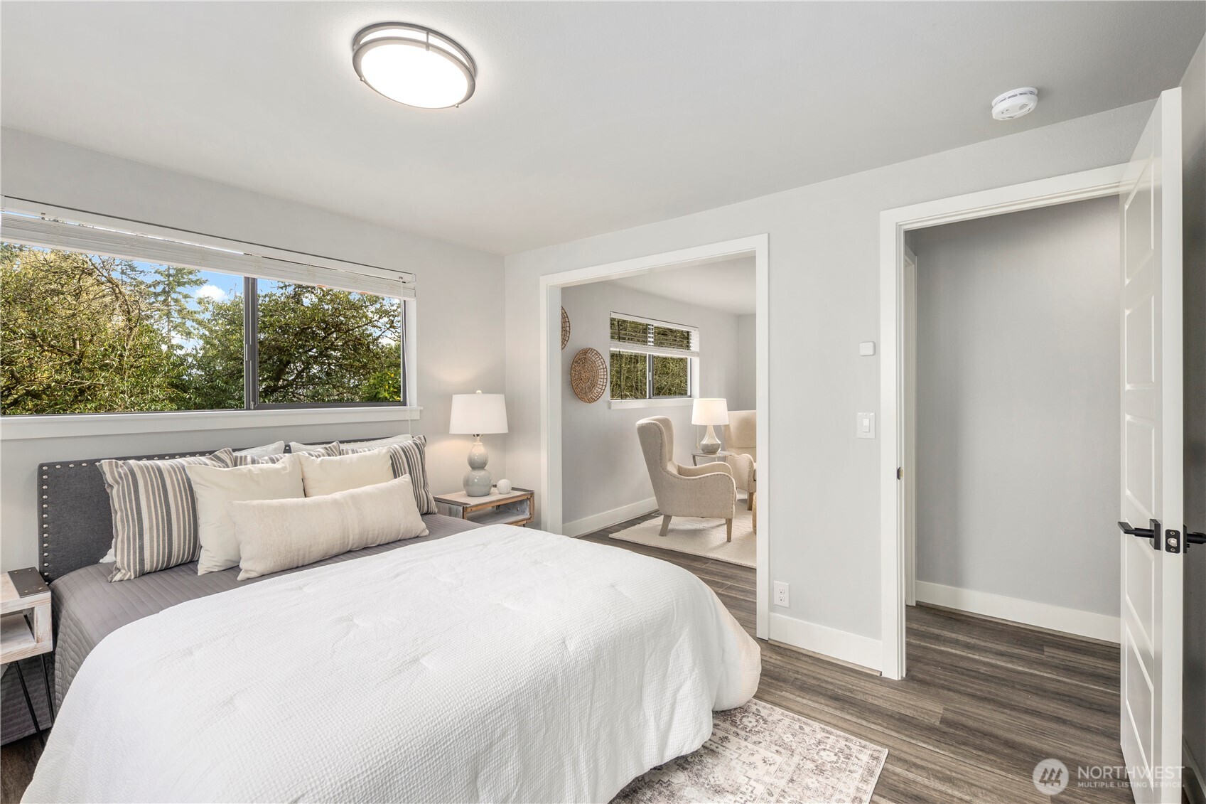 9 216th Street Southeast Bothell, WA 98021 - Photo 13 of 28 a bedroom with a bed and wooden floor