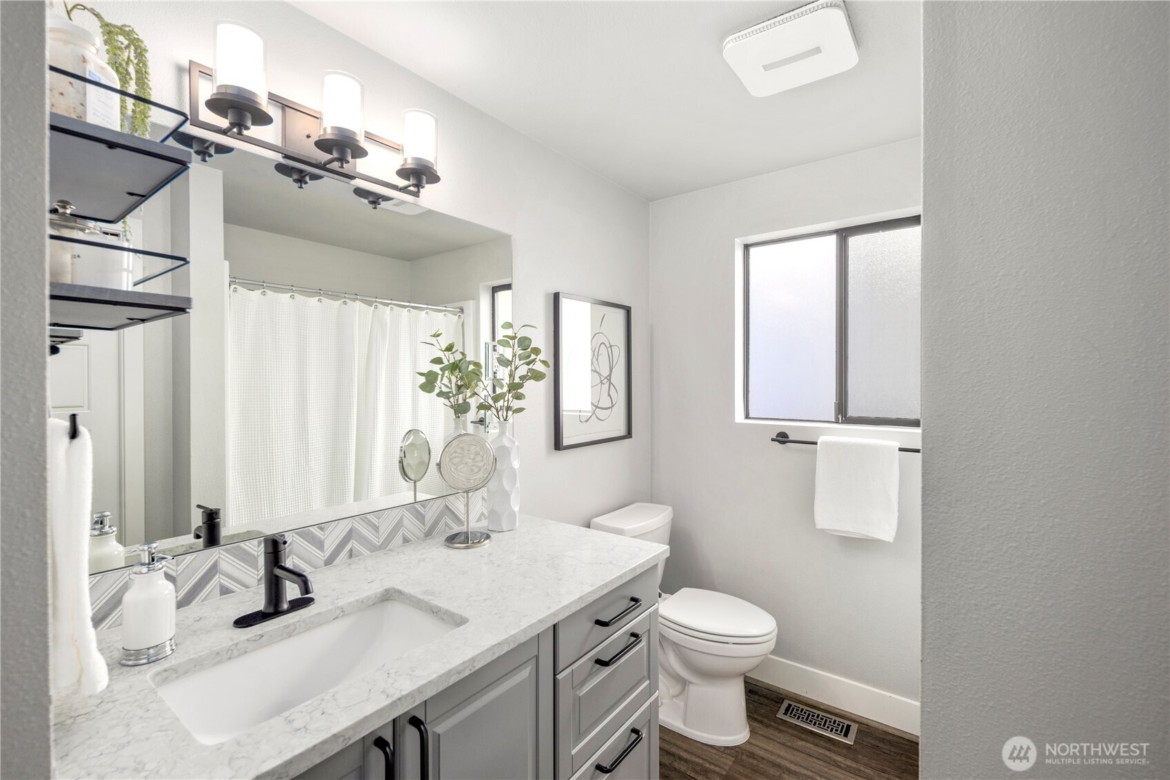 9 216th Street Southeast Bothell, WA 98021 - Photo 16 of 28 a bathroom with a granite countertop sink toilet and mirror