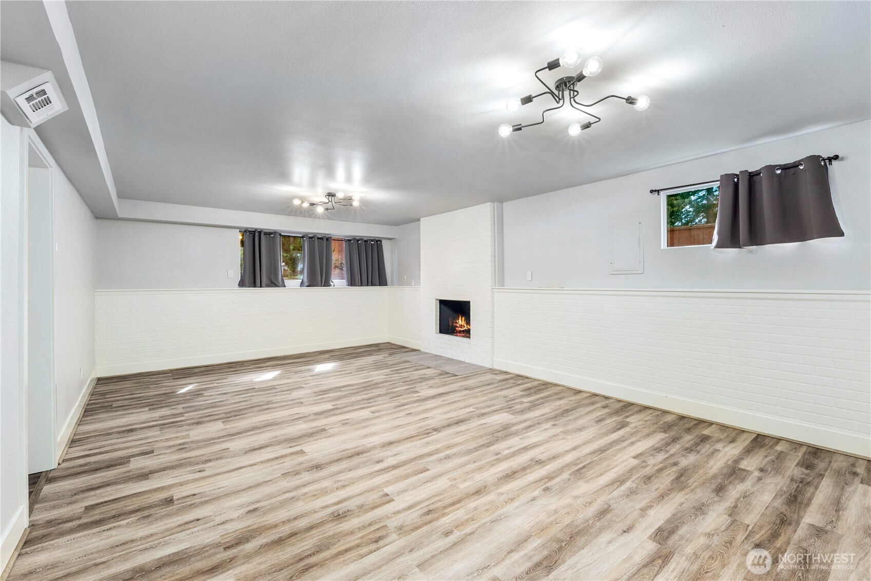 9 216th Street Southeast Bothell, WA 98021 - Photo 20 of 28 wooden floor in an empty room with a chandelier fan
