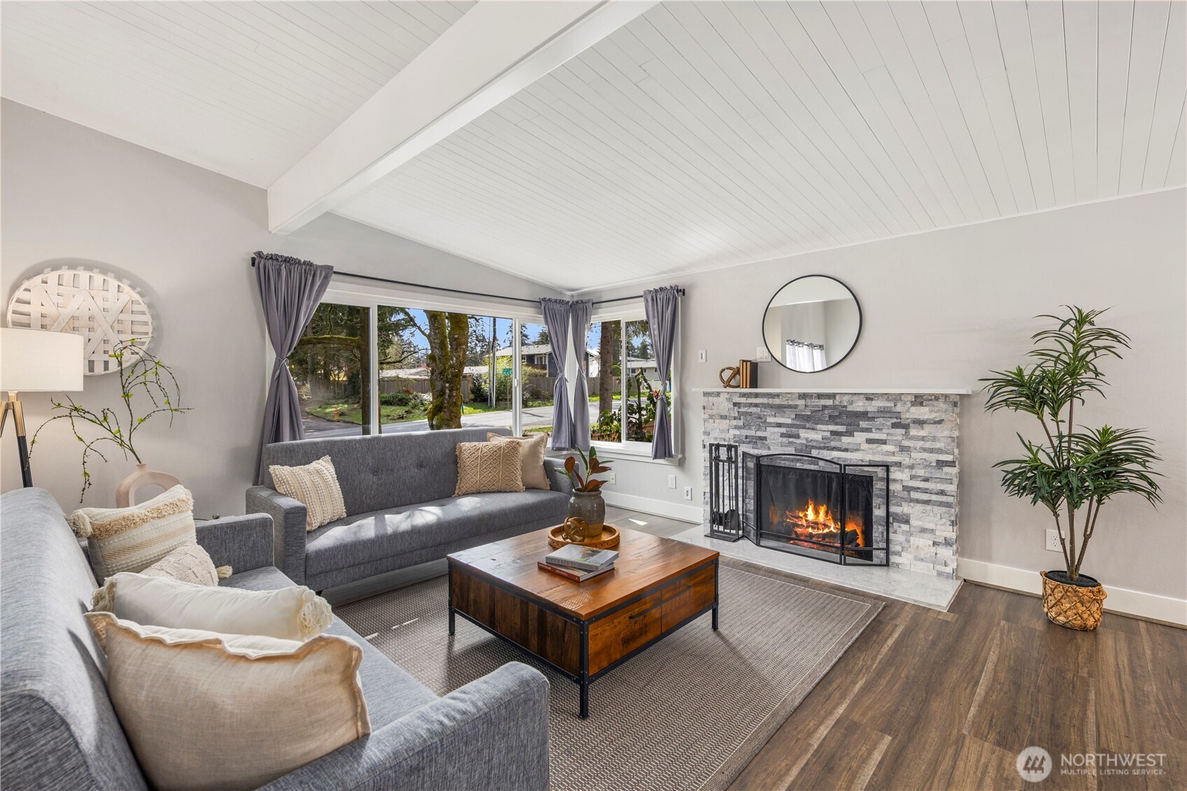 9 216th Street Southeast Bothell, WA 98021 - Photo 2 of 28 a living room with furniture and a fireplace