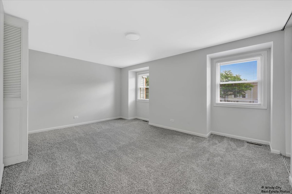 936 Cardiff Court Schaumburg, IL 60169 - Photo 13 of 35 a view of an empty room with a window