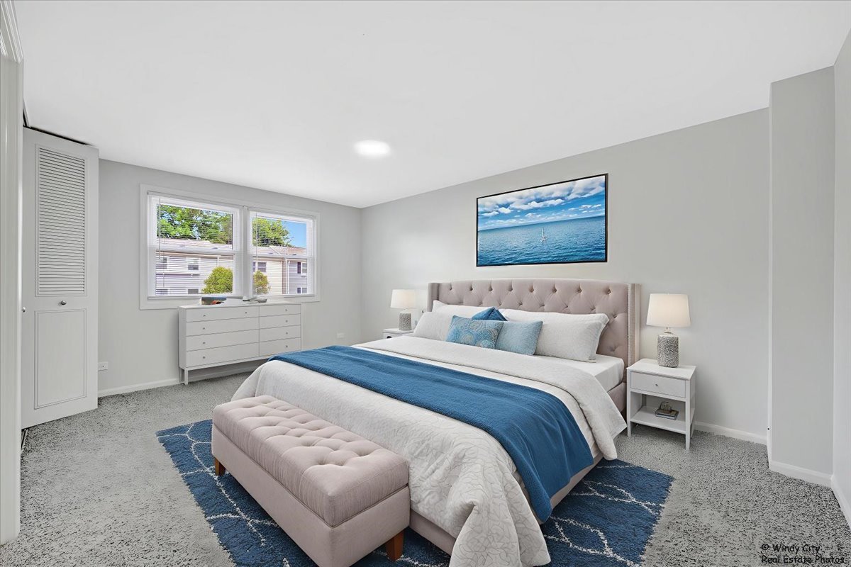 936 Cardiff Court Schaumburg, IL 60169 - Photo 17 of 35 a bedroom with a bed and window