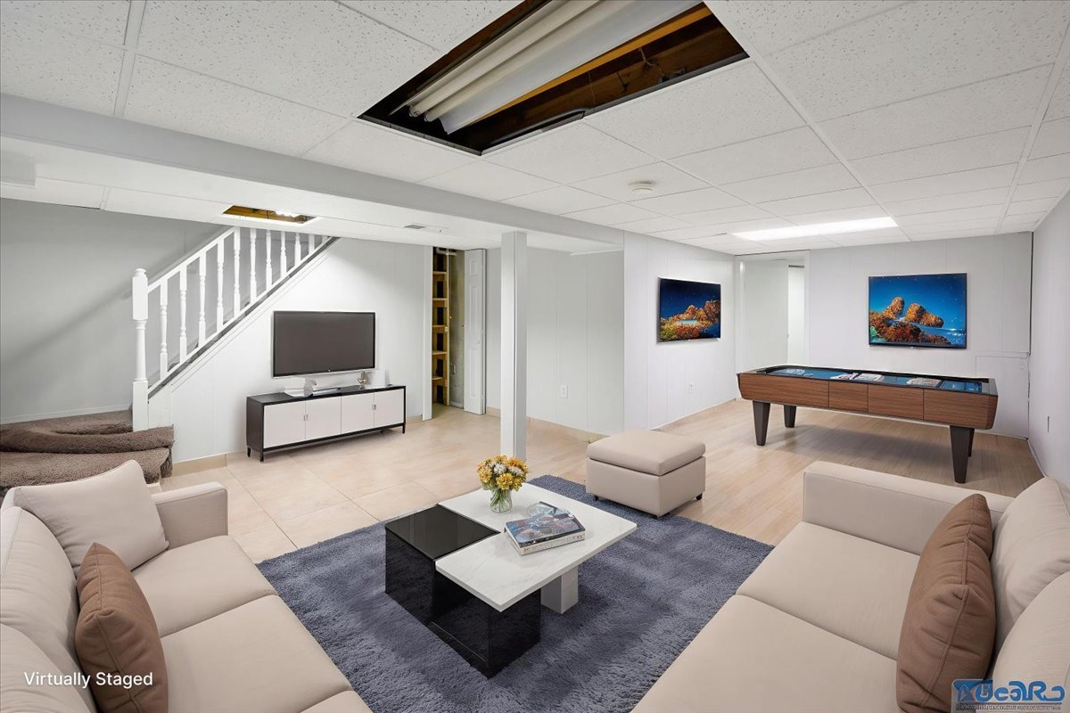 936 Cardiff Court Schaumburg, IL 60169 - Photo 22 of 35 a living room with furniture and a flat screen tv