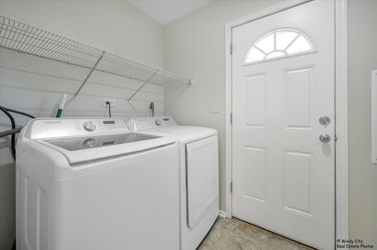 936 Cardiff Court Schaumburg, IL 60169 - Photo 24 of 35 a utility room with dryer and washer