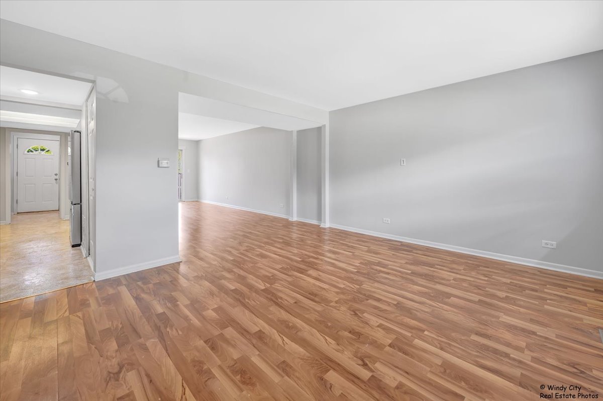 936 Cardiff Court Schaumburg, IL 60169 - Photo 8 of 35 wooden floor in an empty room