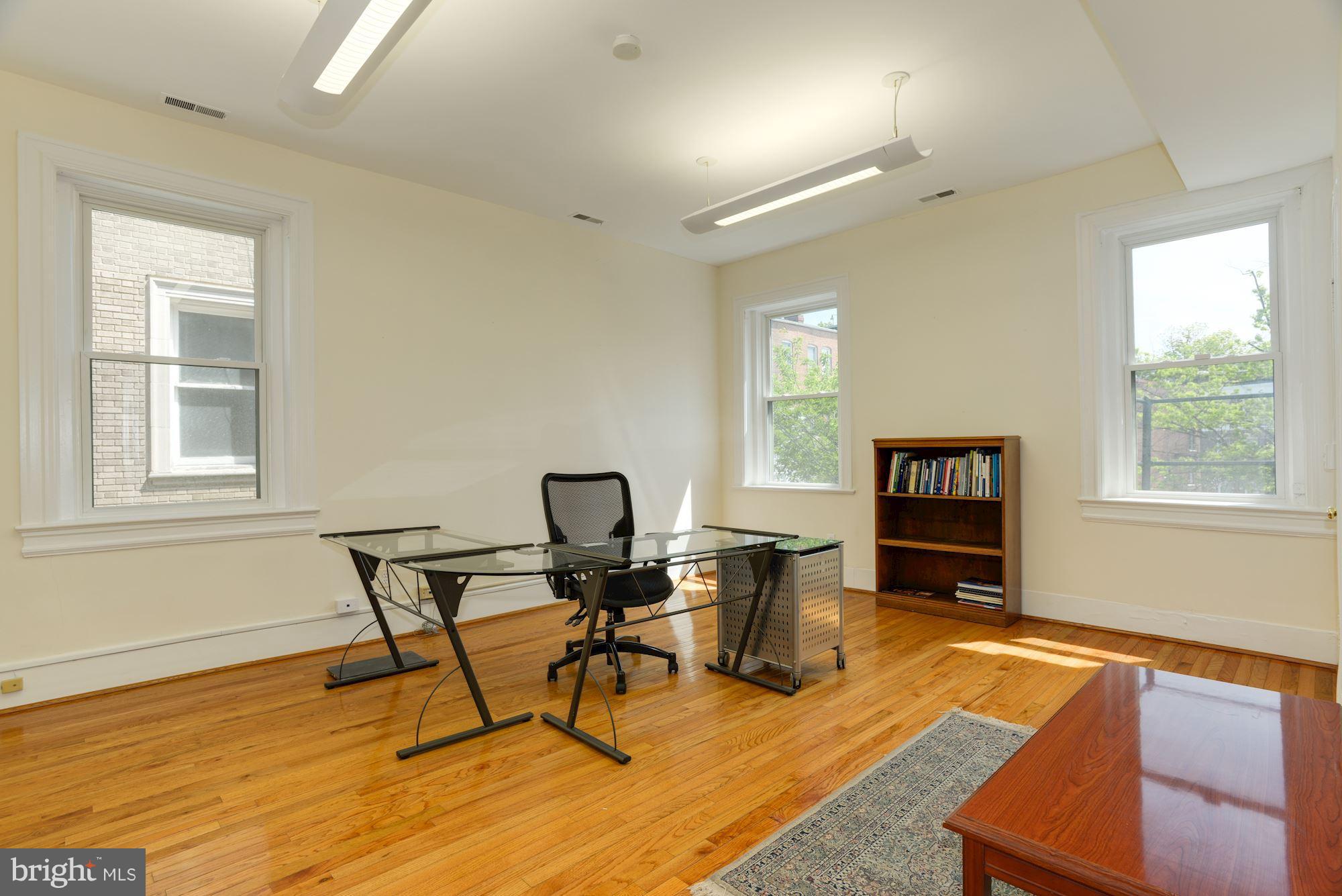 1609 22nd Street Northwest Washington, DC 20008 - Photo 13 of 24 a work room with furniture and a window