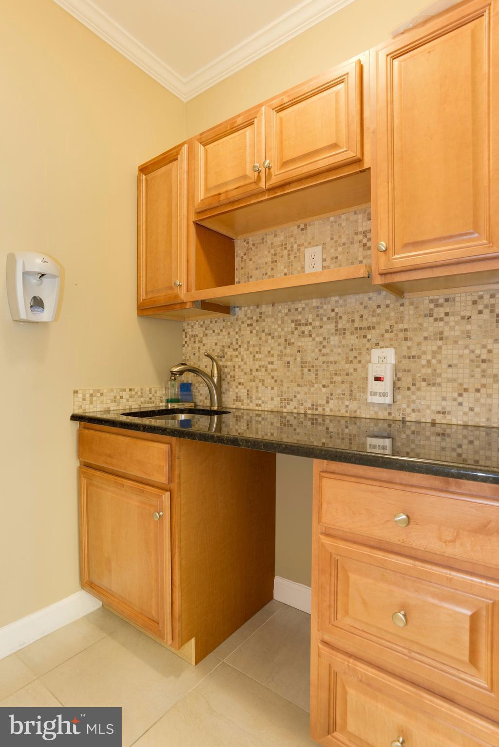 1609 22nd Street Northwest Washington, DC 20008 - Photo 17 of 24 a bathroom with a sink and a mirror