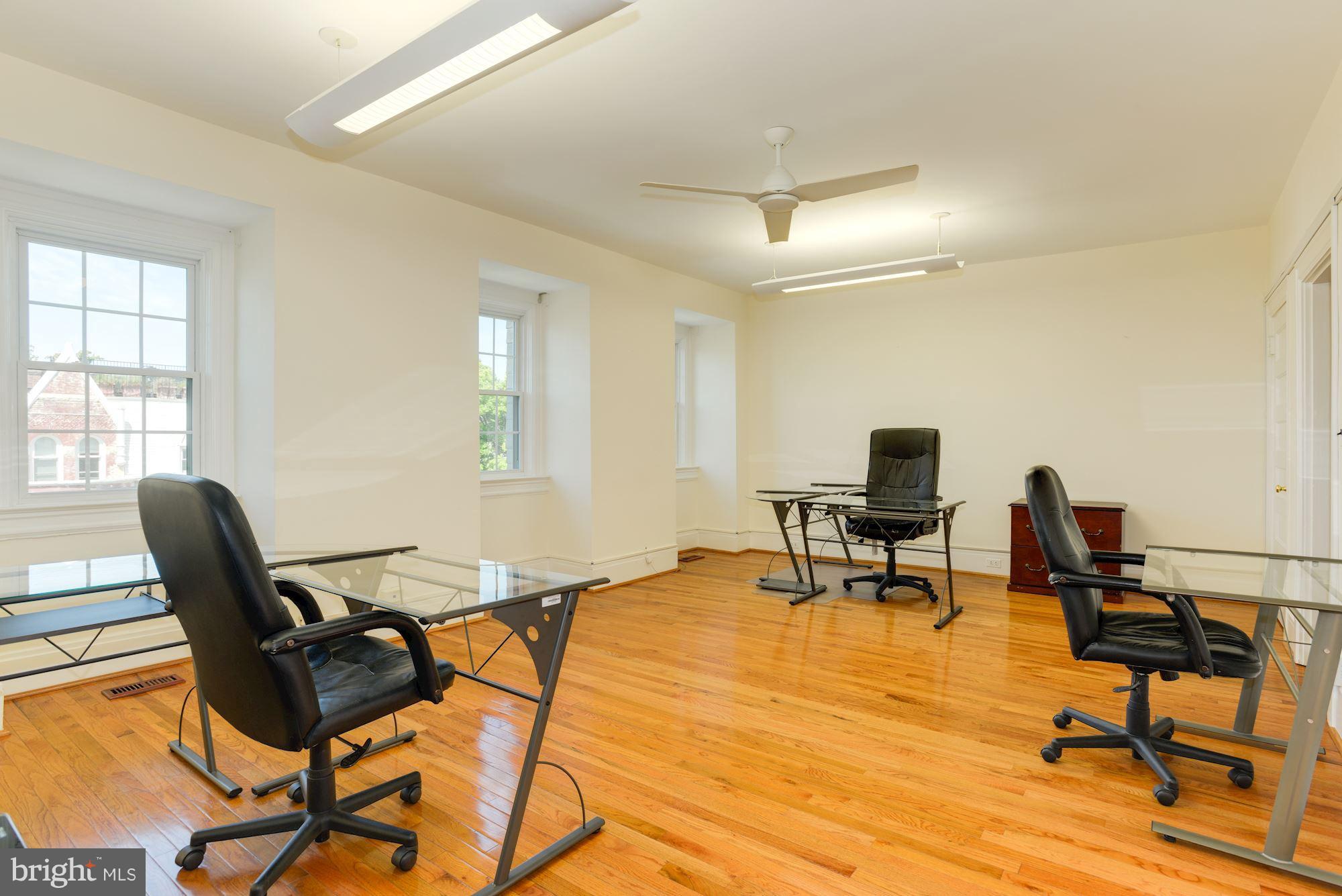 1609 22nd Street Northwest Washington, DC 20008 - Photo 20 of 24 a view of a workspace with furniture and a window