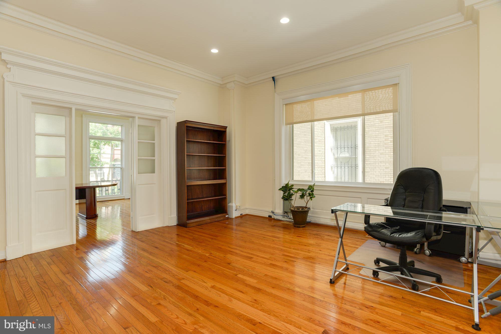 1609 22nd Street Northwest Washington, DC 20008 - Photo 8 of 24 a view of a workspace with furniture and a window