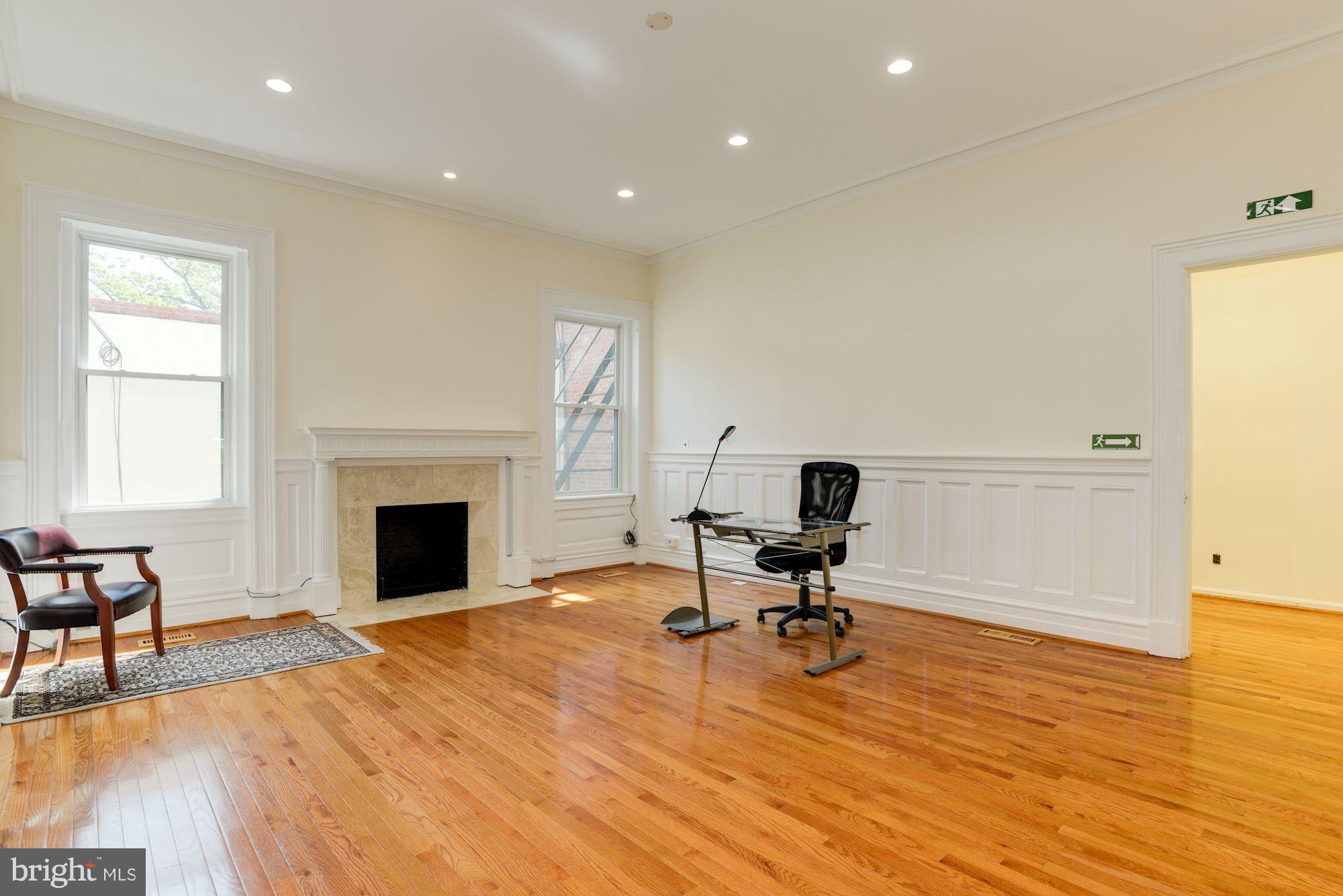 1609 22nd Street Northwest Washington, DC 20008 - Photo 9 of 24 a view of a workspace with furniture and a fireplace