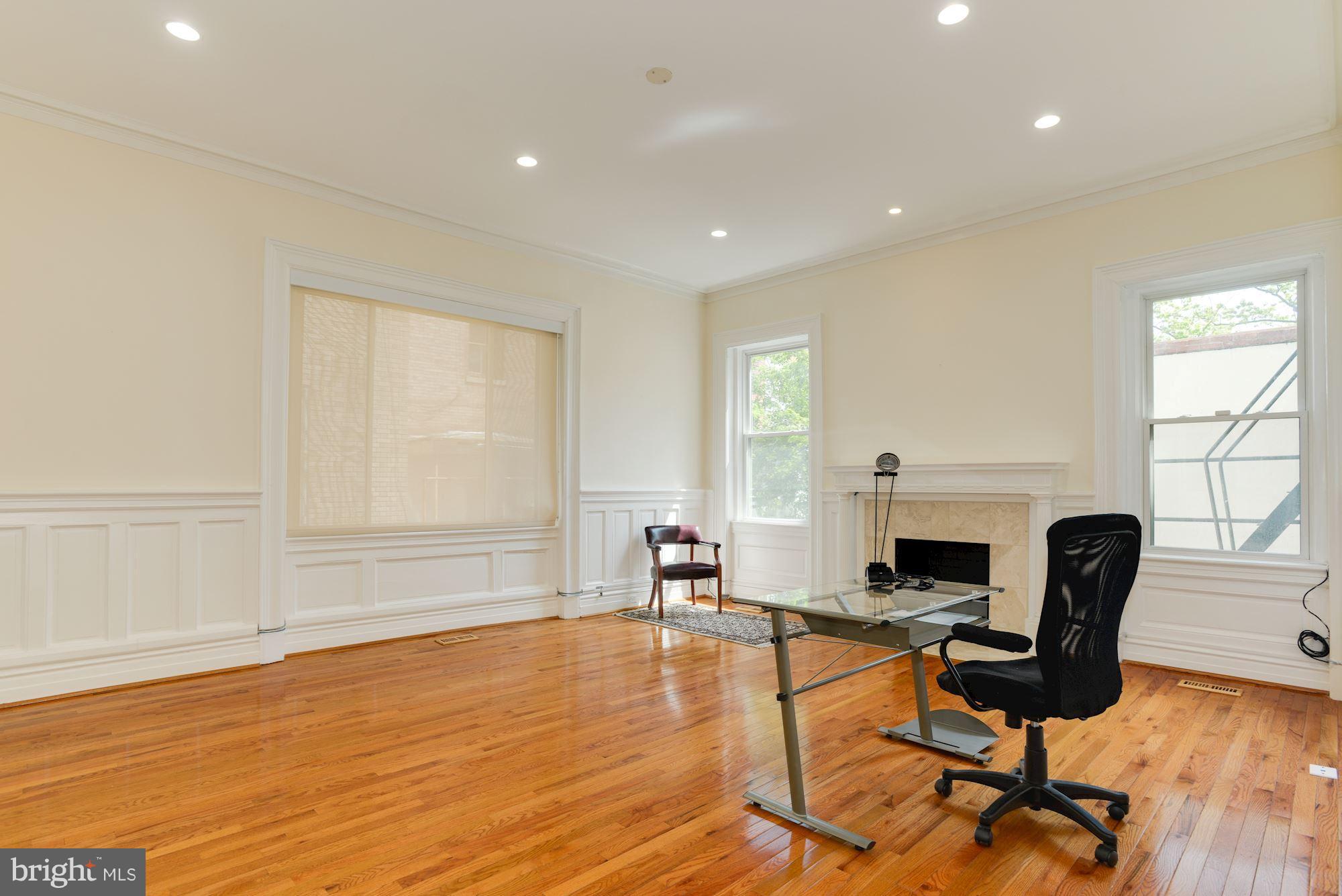 1609 22nd Street Northwest Washington, DC 20008 - Photo 10 of 24 a living room with furniture and a fireplace