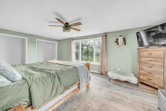 a bathroom with a toilet sink and shower