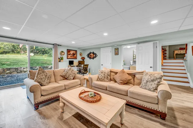 a bedroom that has a bed and a chandelier