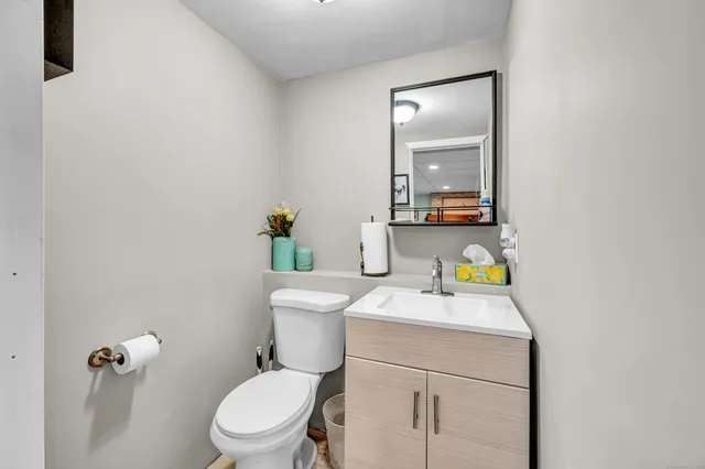 a living room with furniture a table and a fireplace