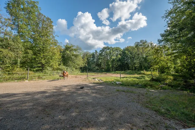 a view of a house with a big yard