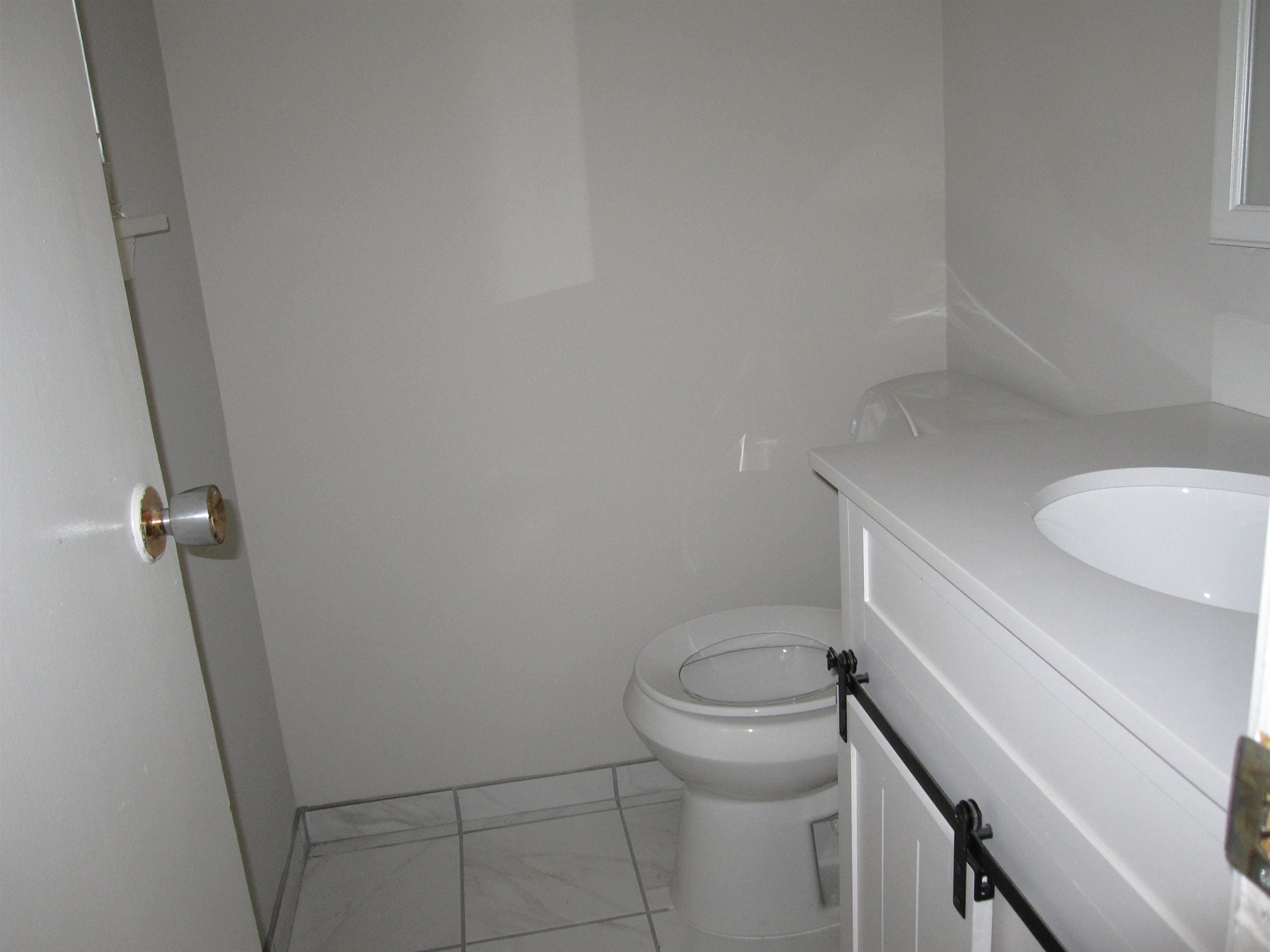 935 Poplar Leaf Road Collierville, TN 38017 - Photo 13 of 19 a bathroom with a sink and toilet